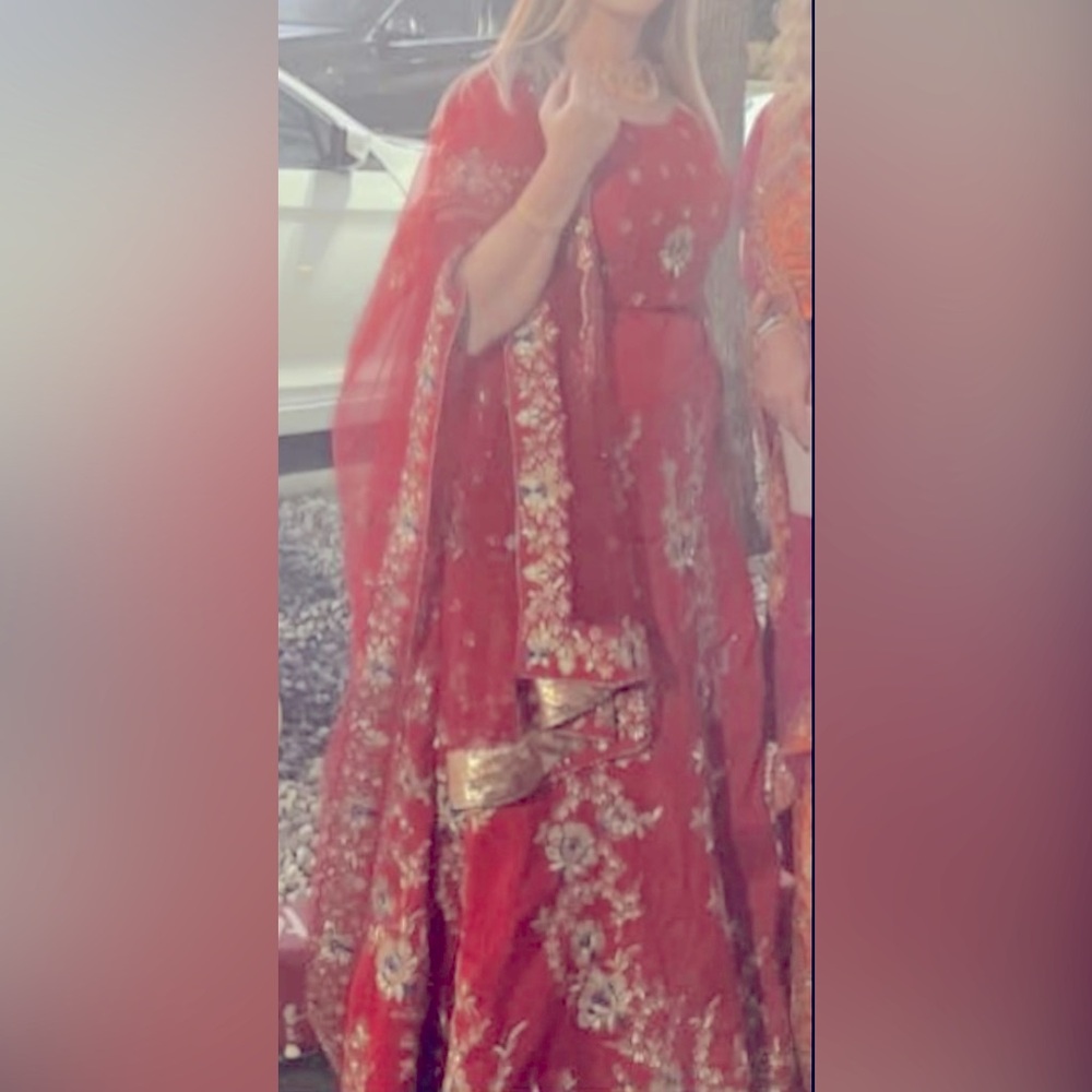 Red and Gold Lehenga with Intricate embroidery, tassels and Flared Silhouette